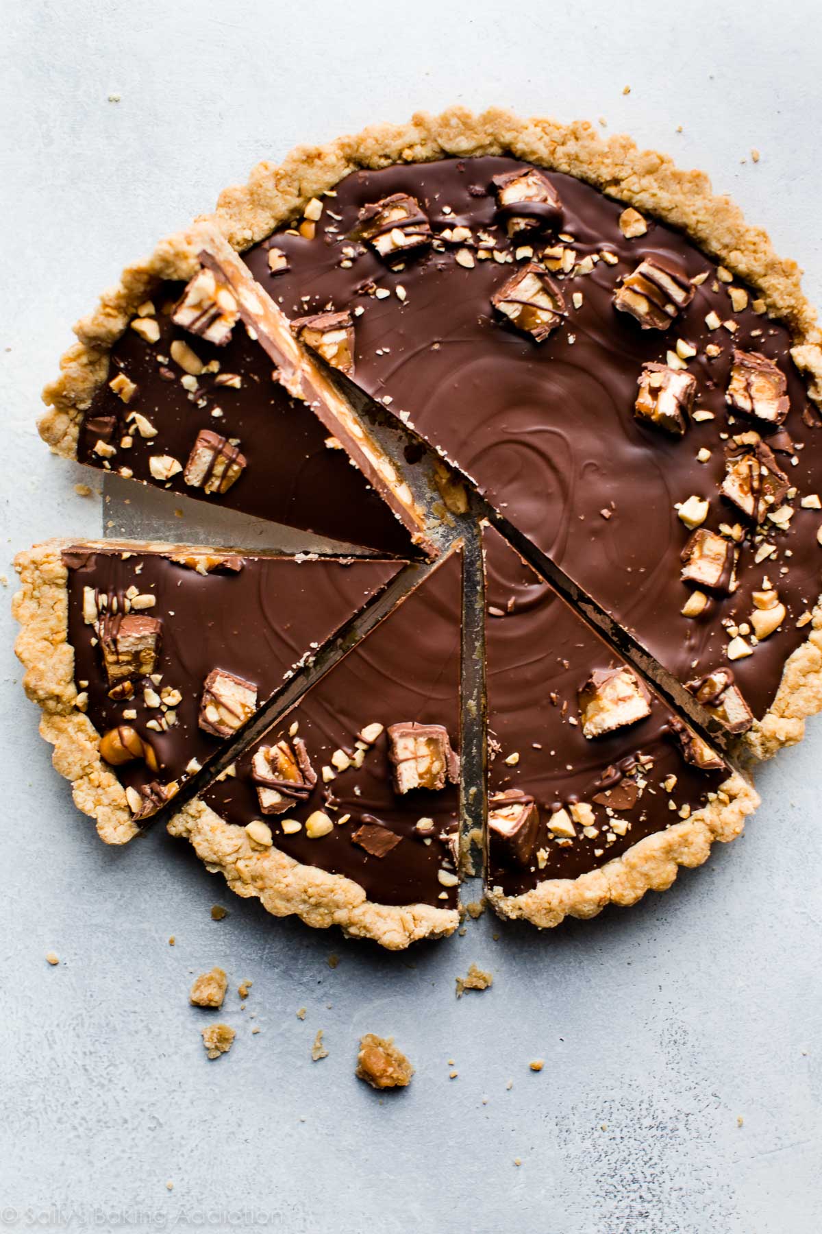 Snickers caramel tart cut into slices