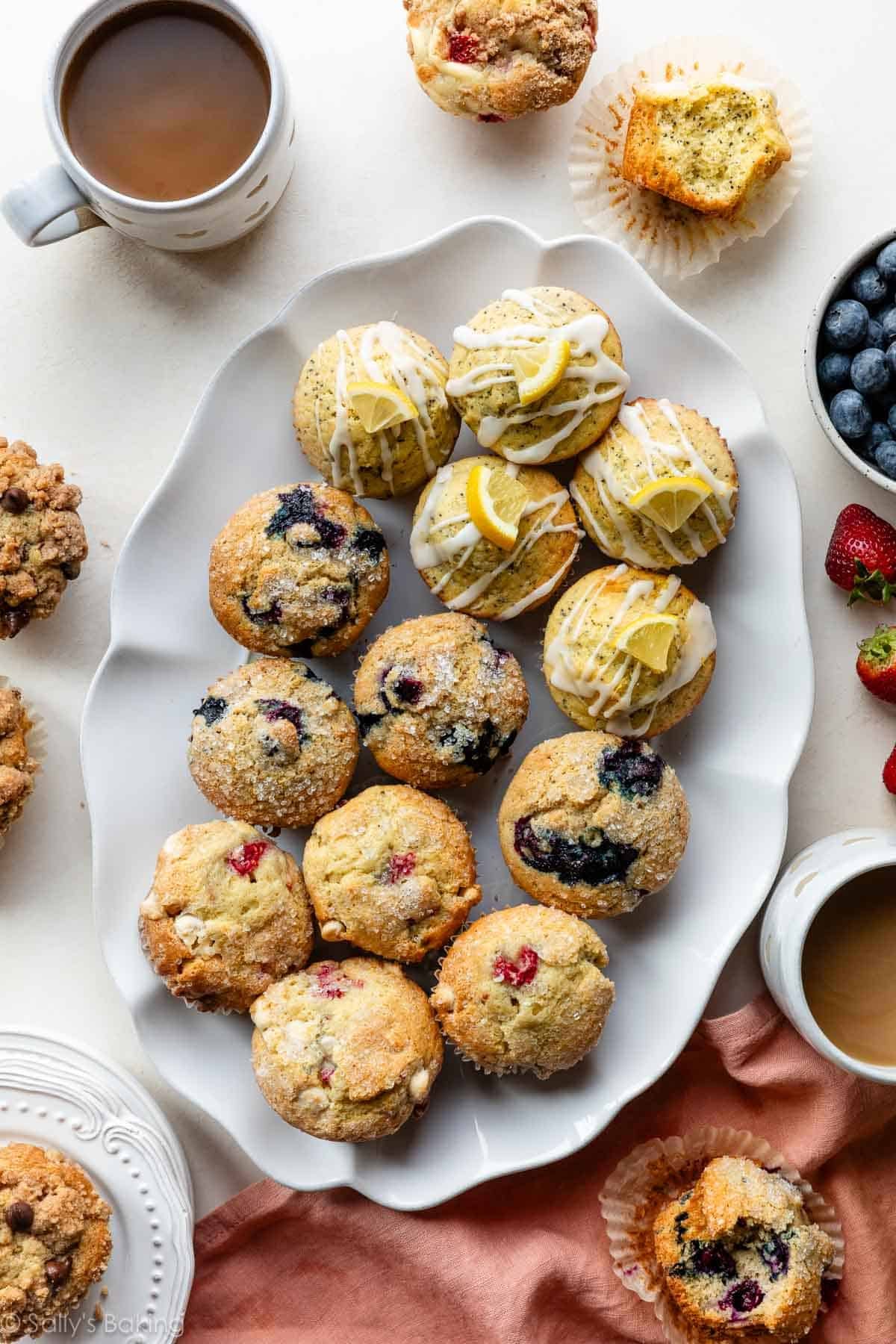 different muffin varieties on a white platter.