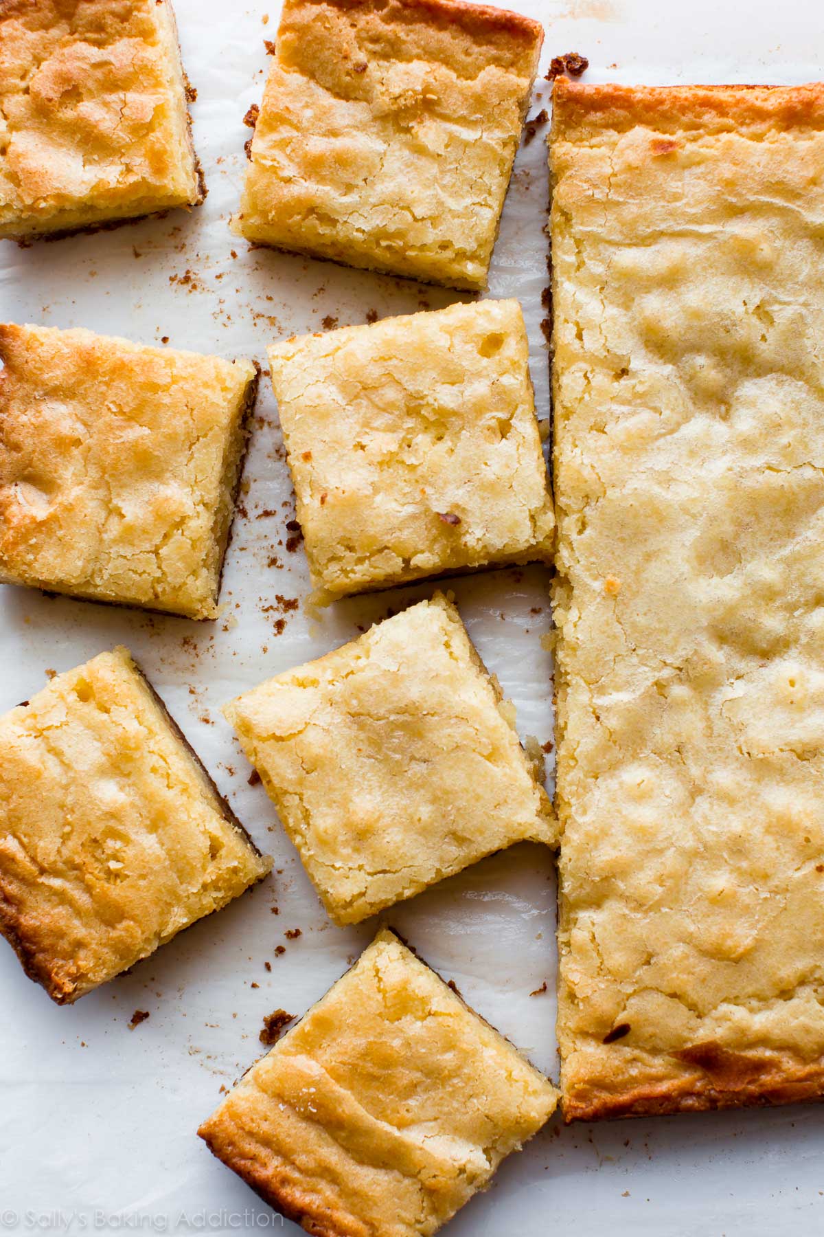 overhead image of white chocolate brownies with a portion cut into squares