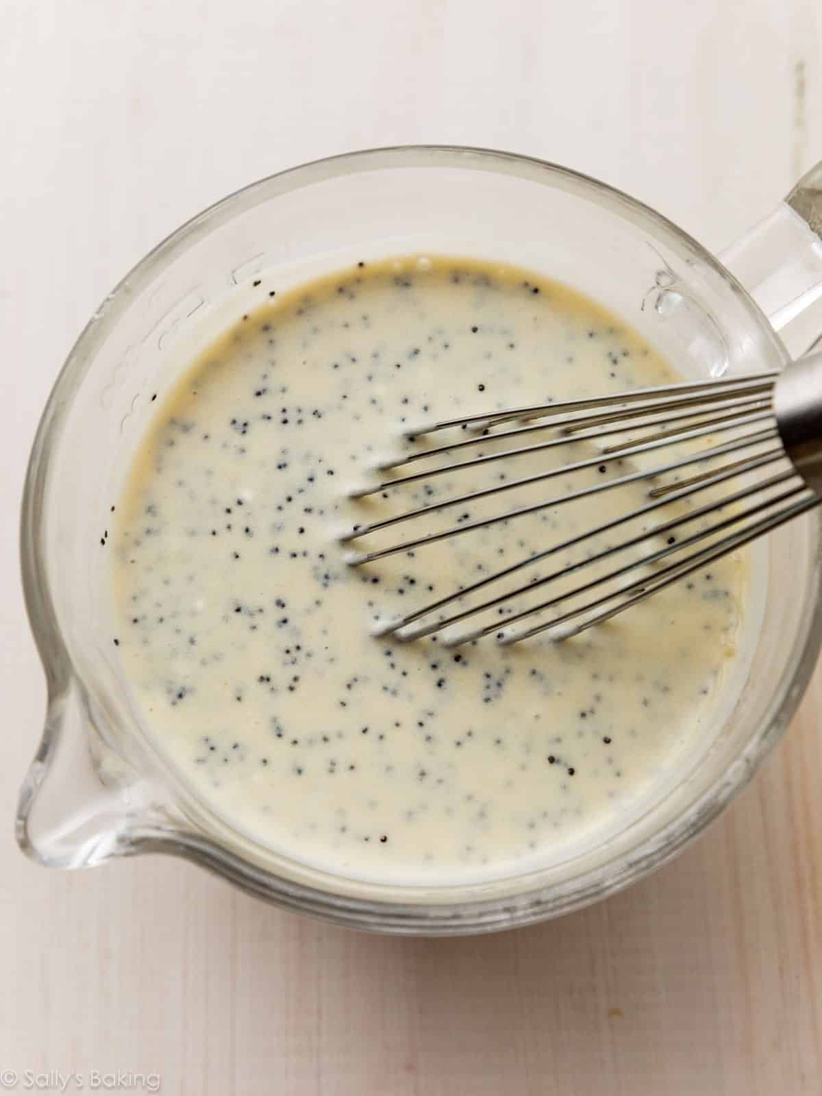 greek yogurt poppy seed dressing in measuring cup.