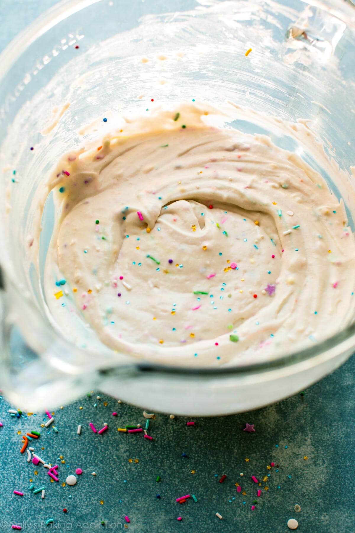 sprinkle cupcake batter in a glass bowl