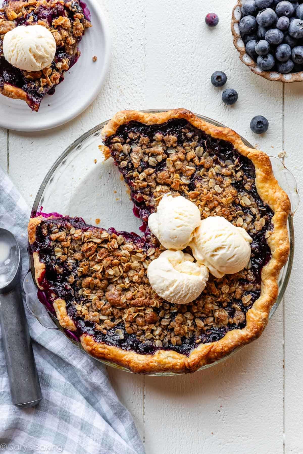 blueberry crumble pie with ice cream on top.