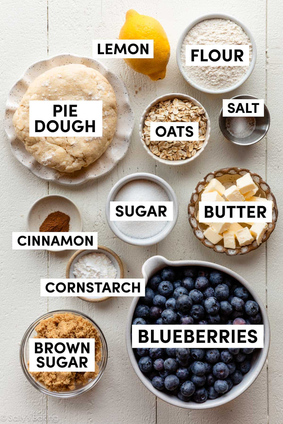 ingredients in bowls including butter, sugar, brown sugar, oats, cornstarch, and cinnamon.