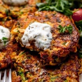sweet potato zucchini fritter with forkful removed.