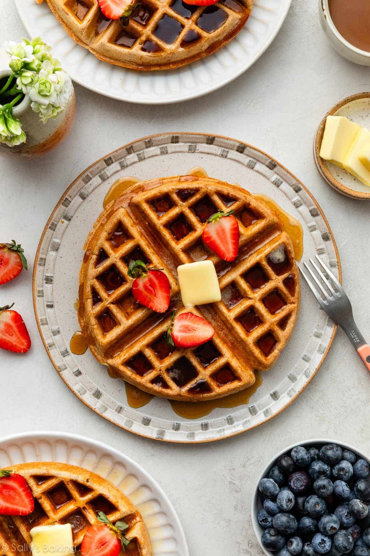 whole wheat waffles on plates.