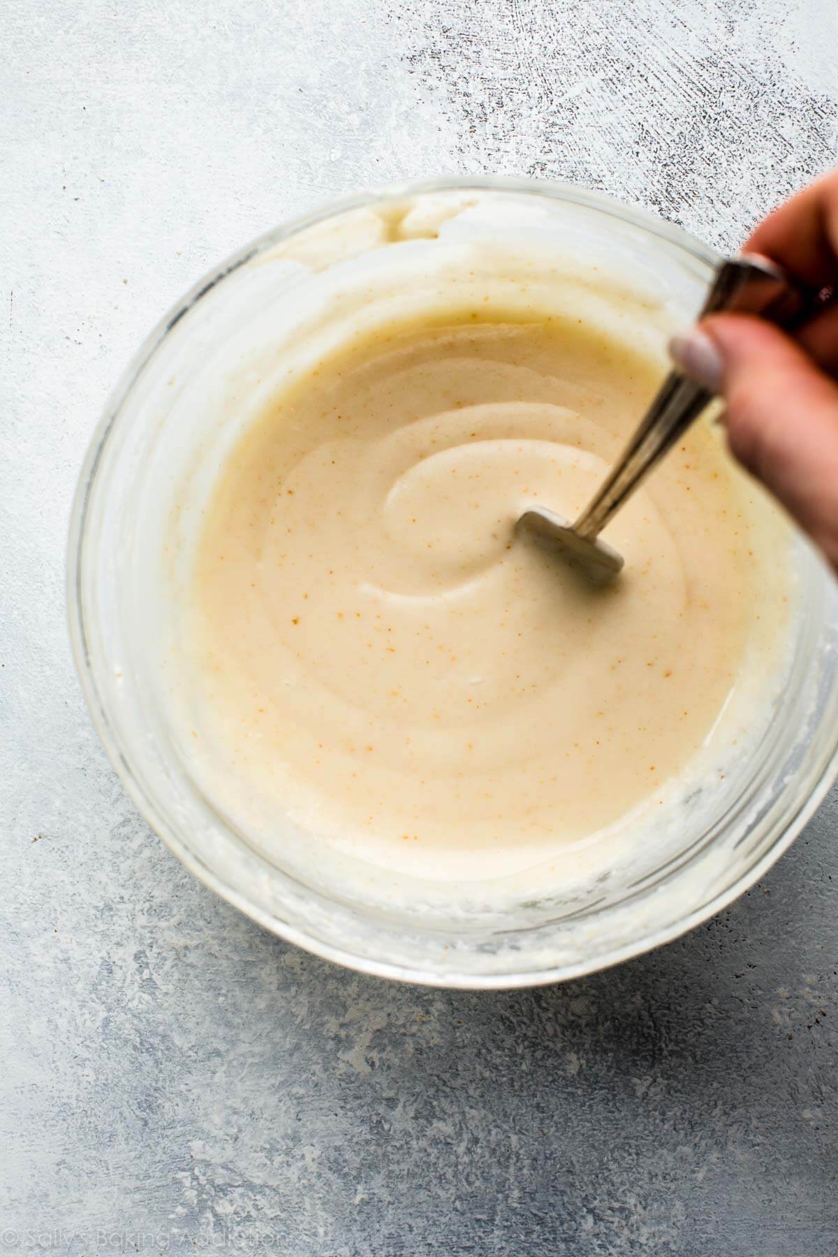 brown butter icing in a glass bowl