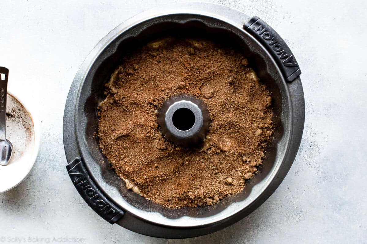 layer of chai spice mixture on top of cake batter in a bundt cake pan