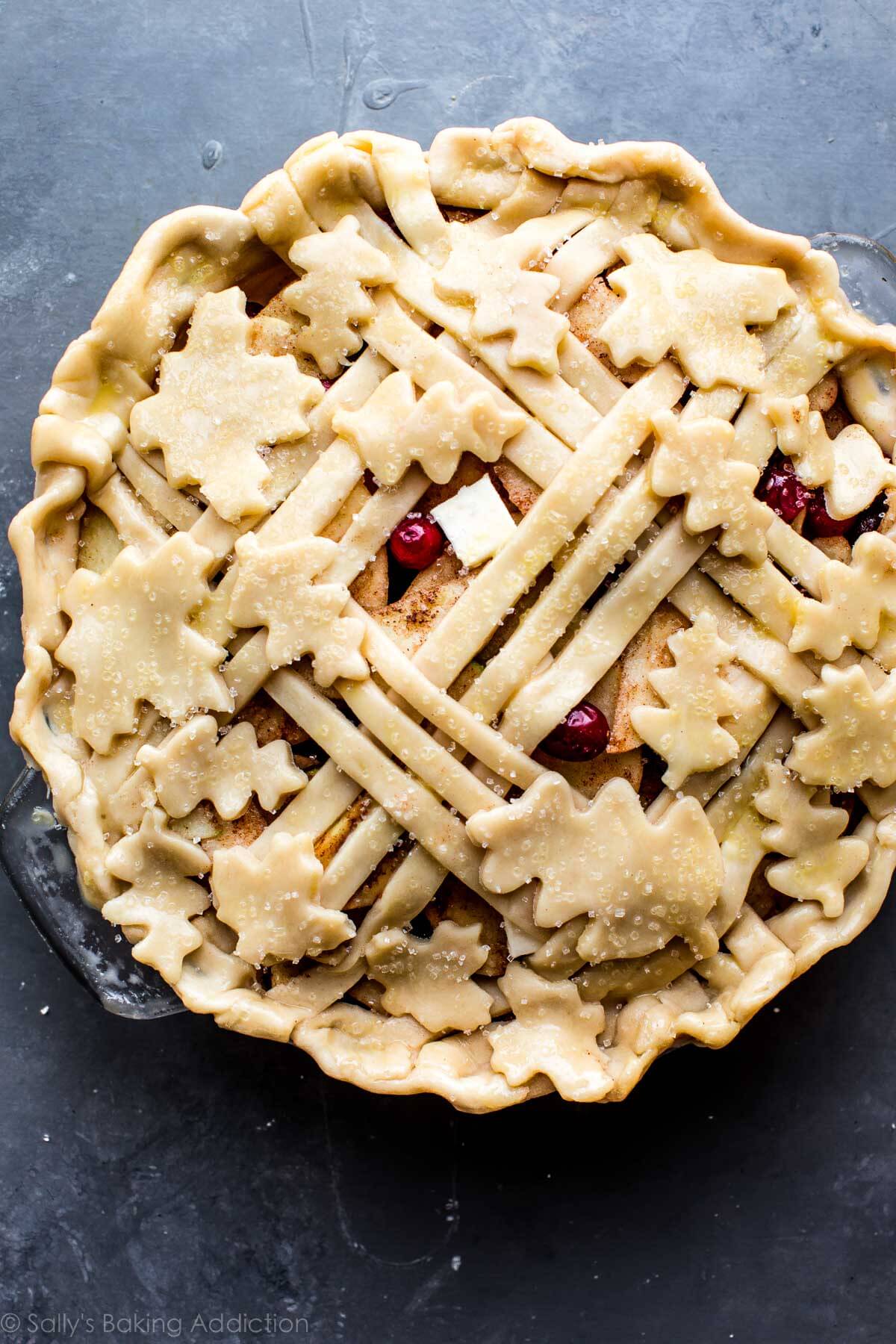 latticed pie crust dough with leaf pie crust shapes