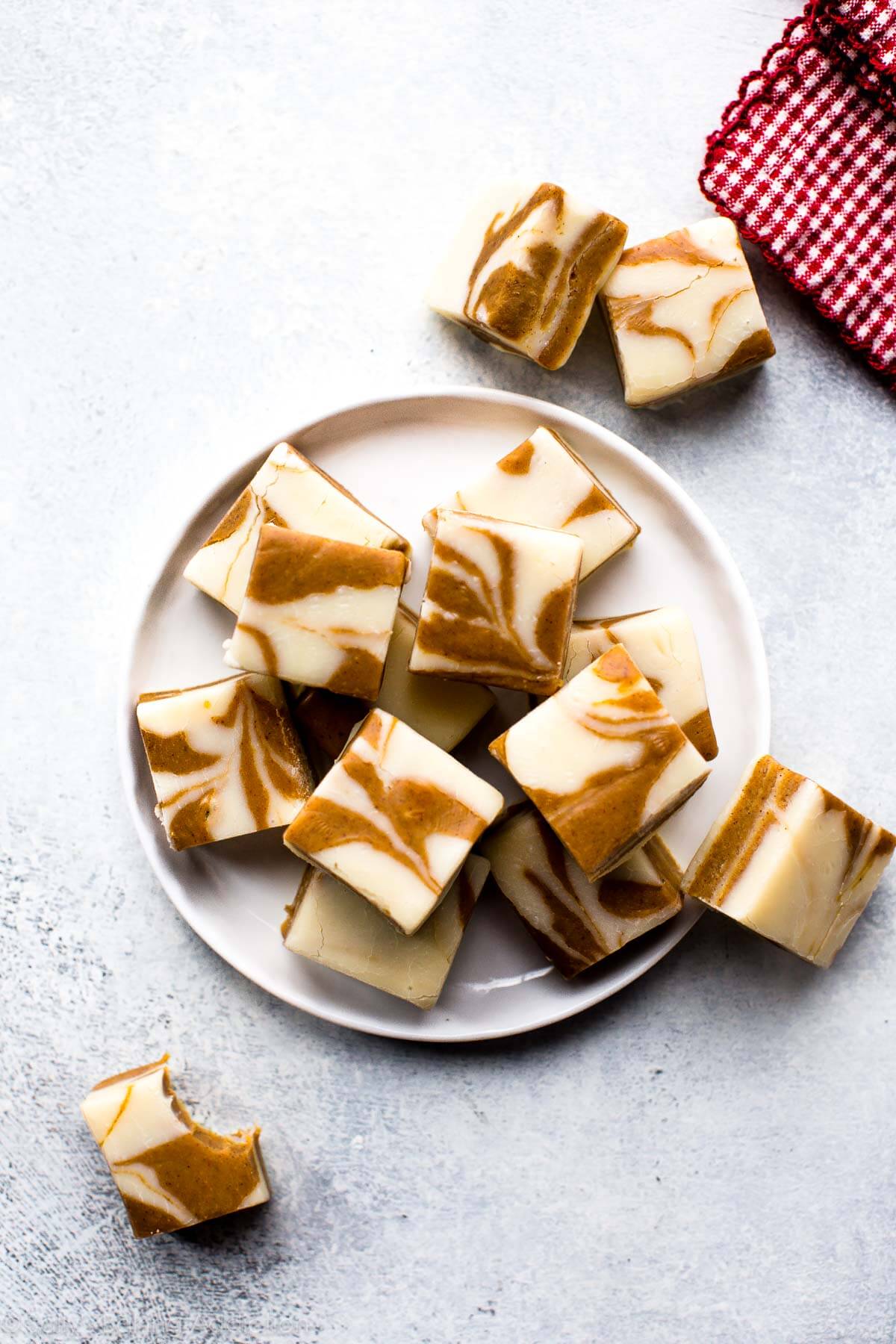 squares of gingerbread fudge on a white plate