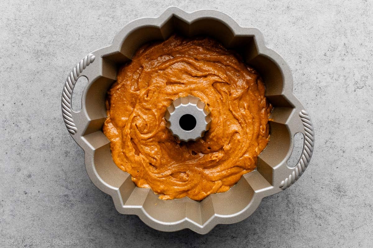 batter in Nordic Ware Bundt Cake Pan on gray backdrop.