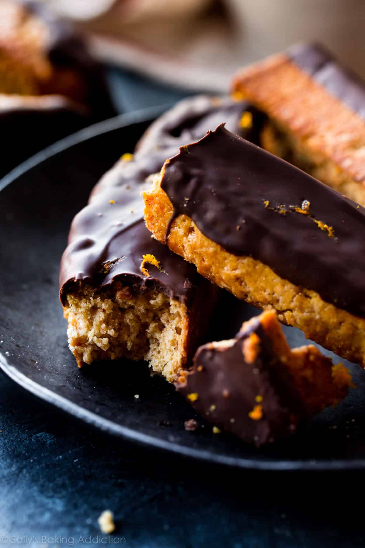 dark chocolate orange biscotti on a black plate