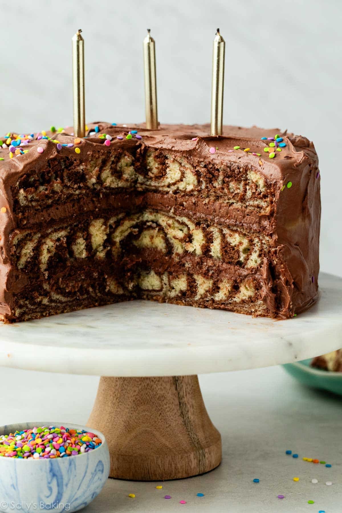 zebra layer cake with chocolate and vanilla on cake stand.