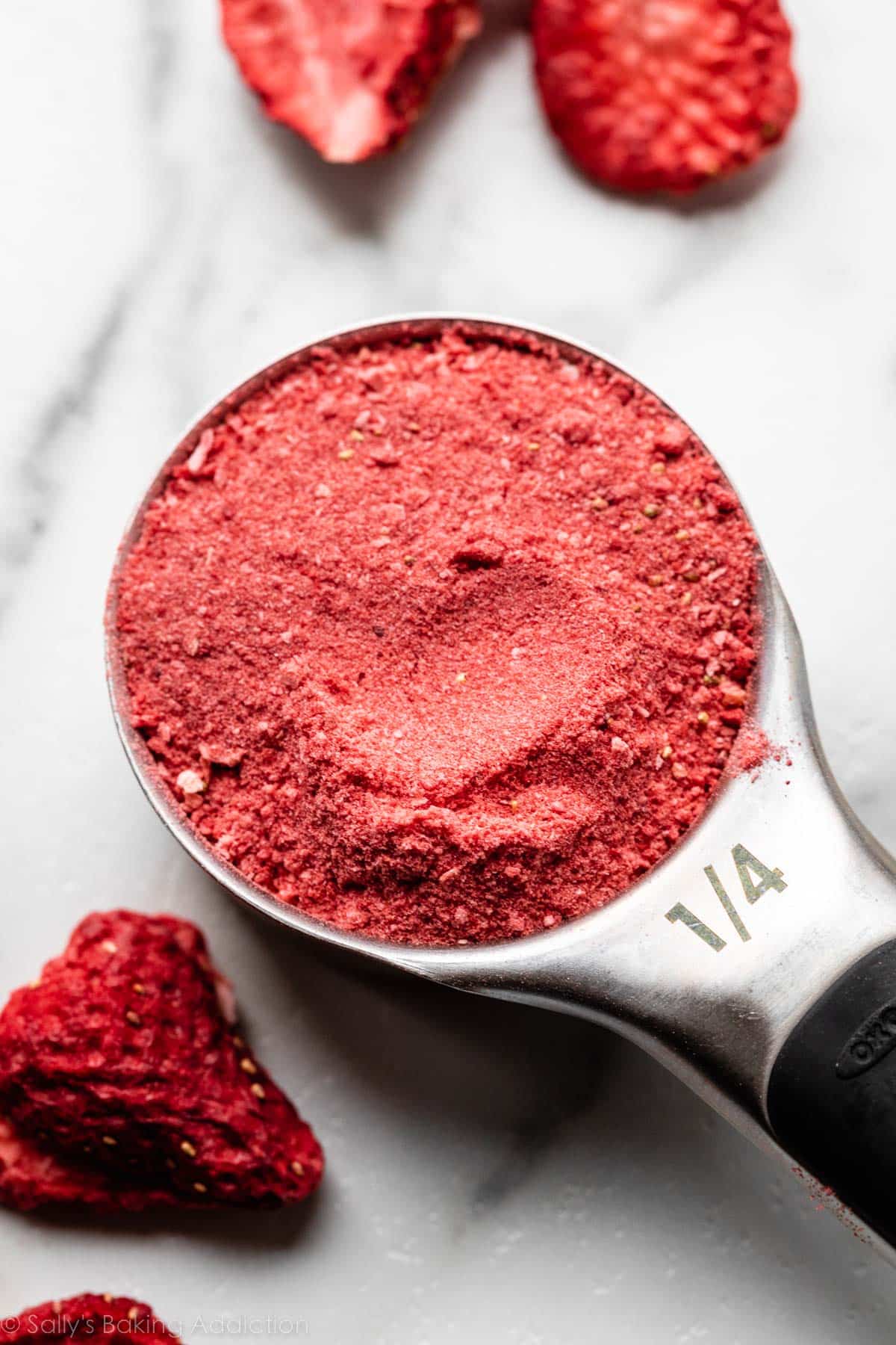 freeze-dried strawberry powder in 1/4 cup measuring cup.