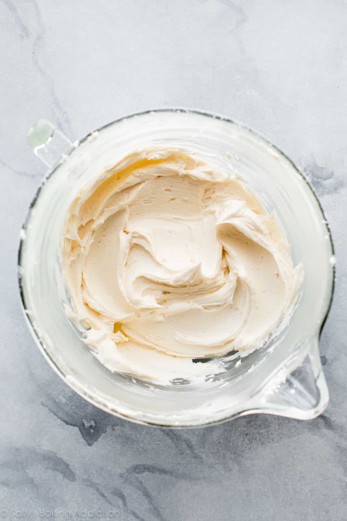 glass bowl of vanilla frosting