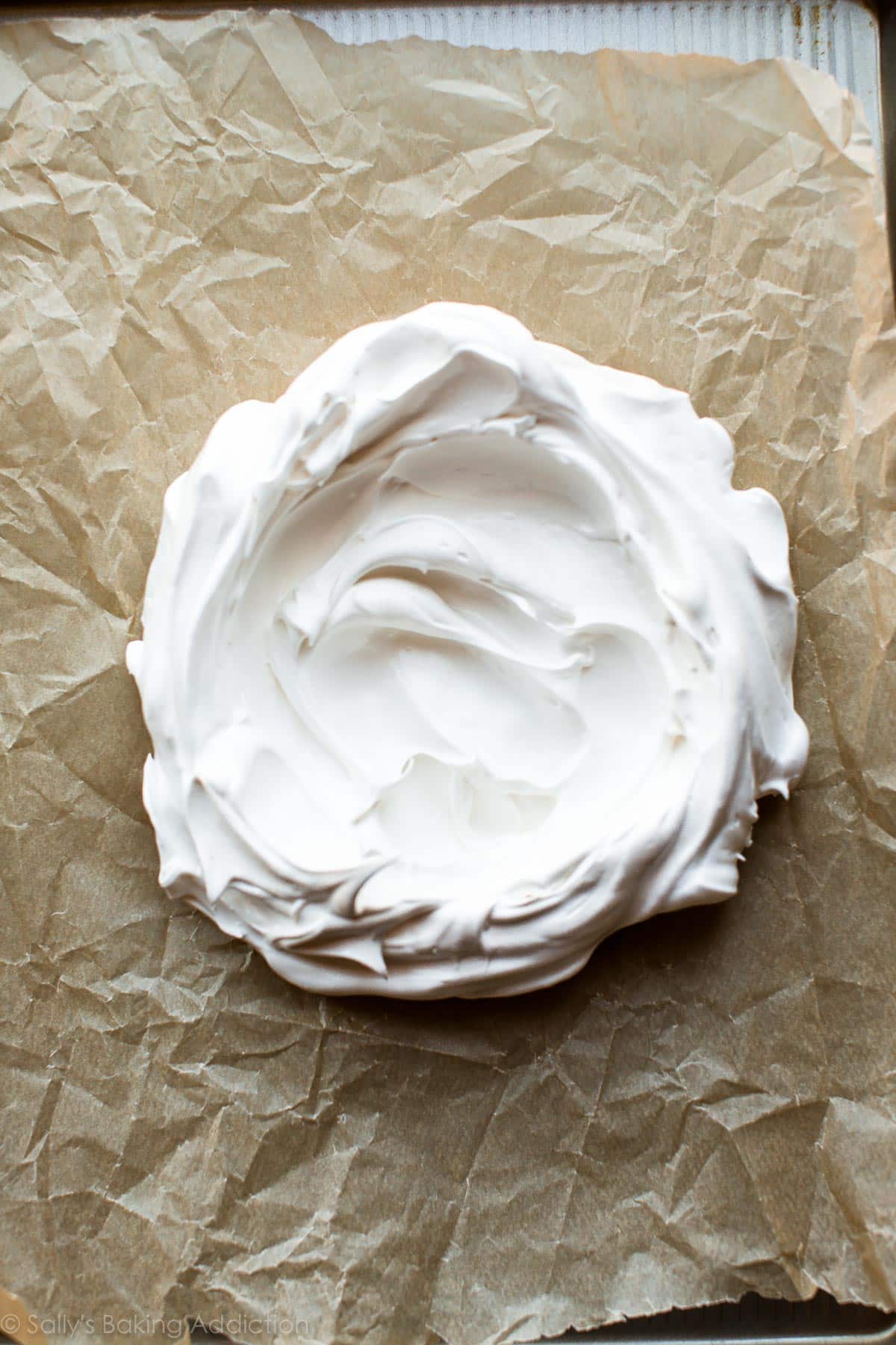 pavlova spread onto a baking sheet before baking