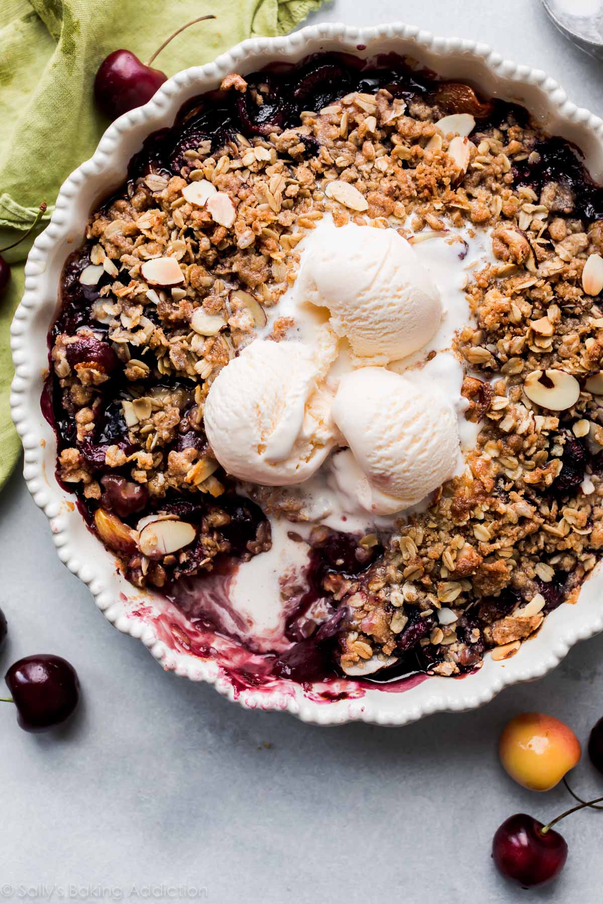 bourbon cherry crisp with ice cream on top