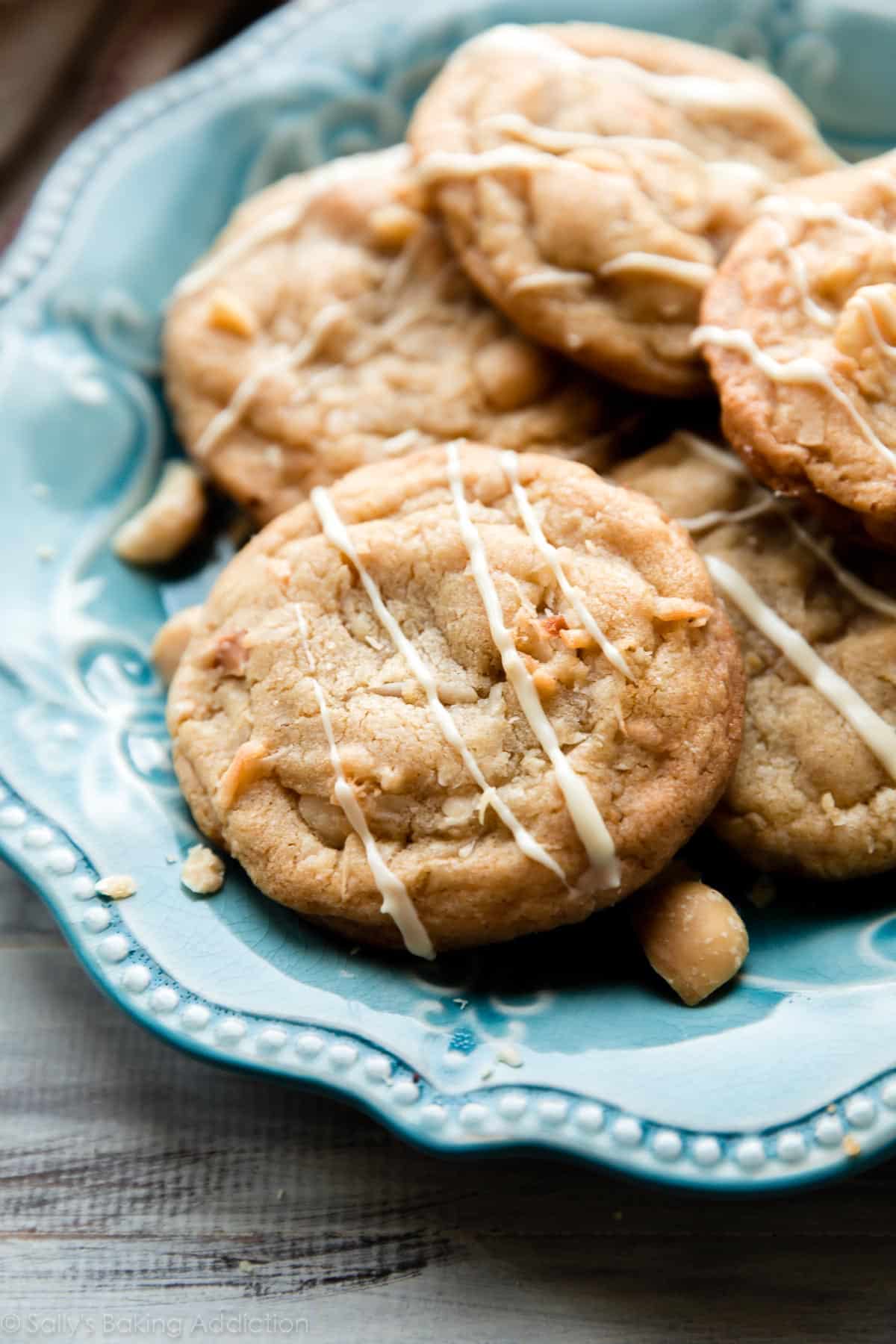 coconut macadamia nut cookies on a teal plate