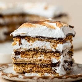 piece of no bake s'mores cake on plate.