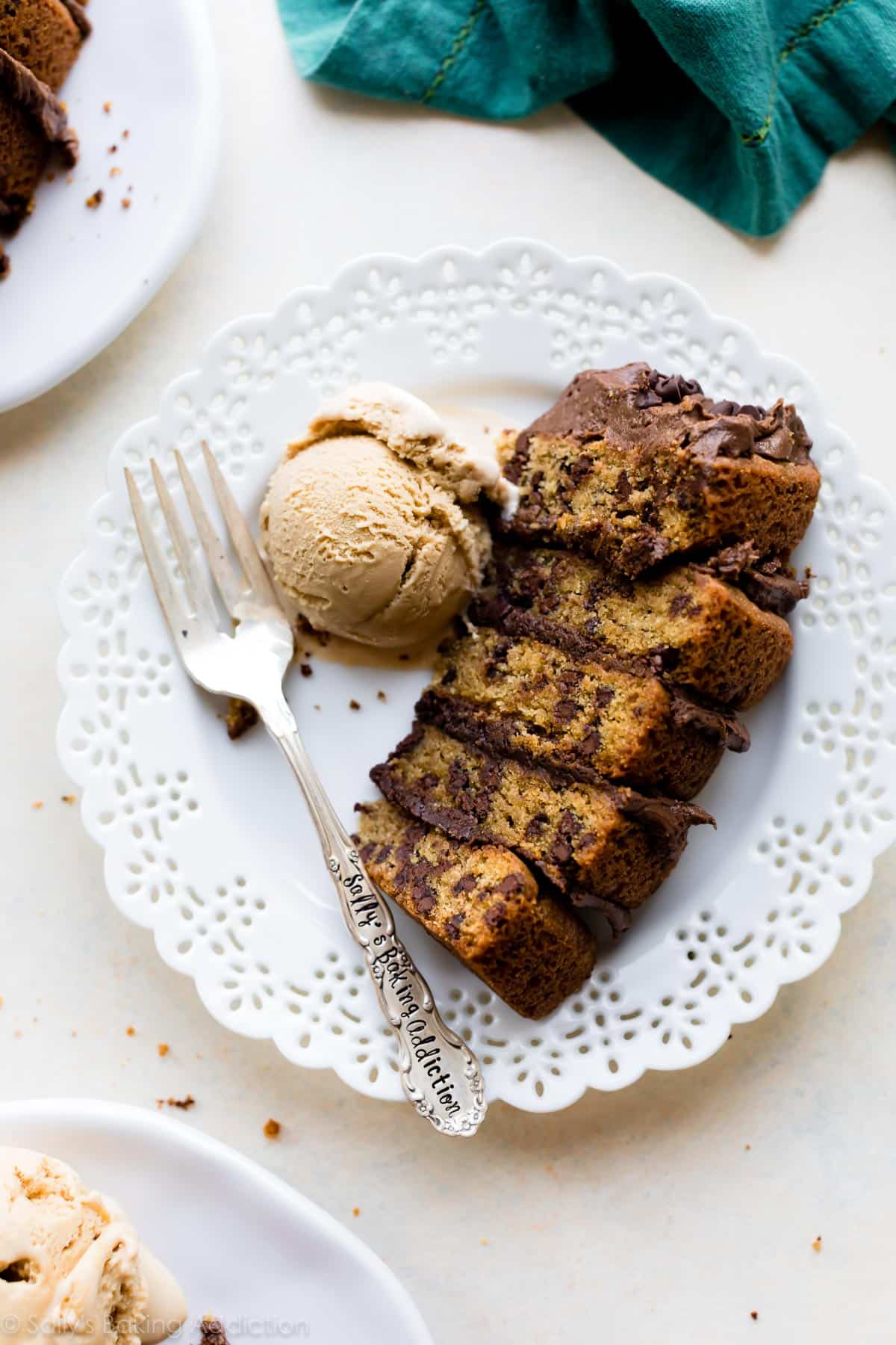 slice of chocolate chip cookie layer cake on a white plate