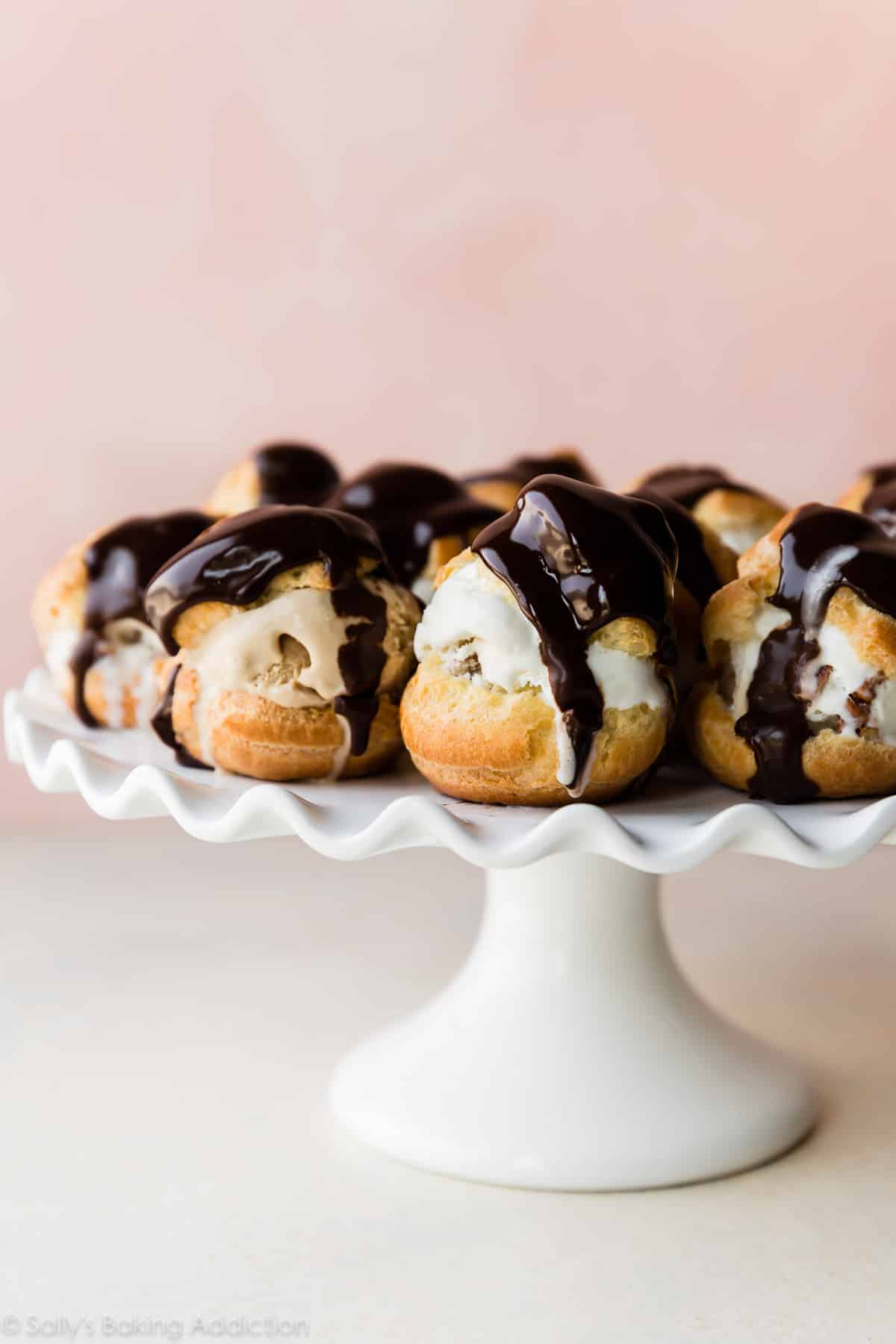 profiteroles on a white cake stand