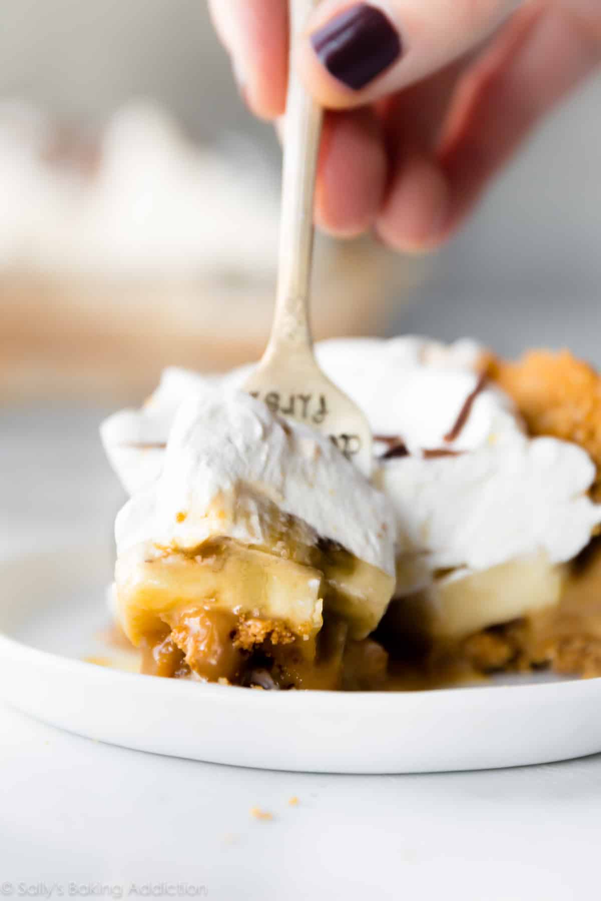 slice of banoffee pie with a fork cutting a bite