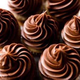 Overhead image of cupcakes topped with chocolate peanut butter frosting