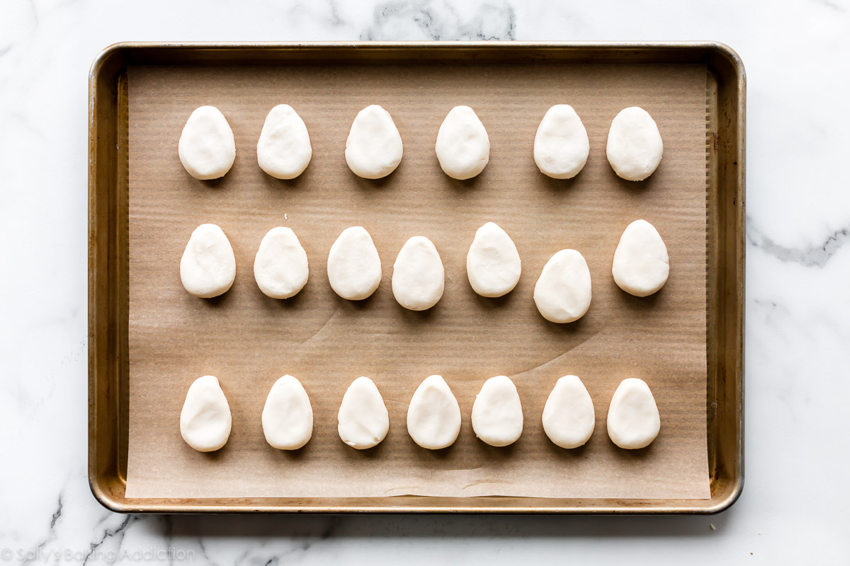 Egg shaped candy on baking sheet