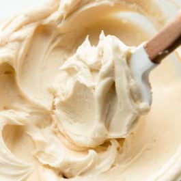 Champagne frosting in glass bowl with spatula