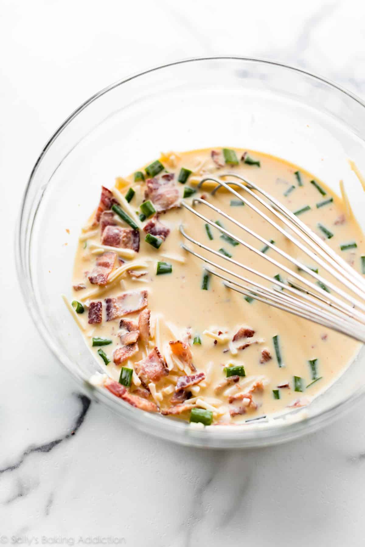 quiche filling in glass mixing bowl