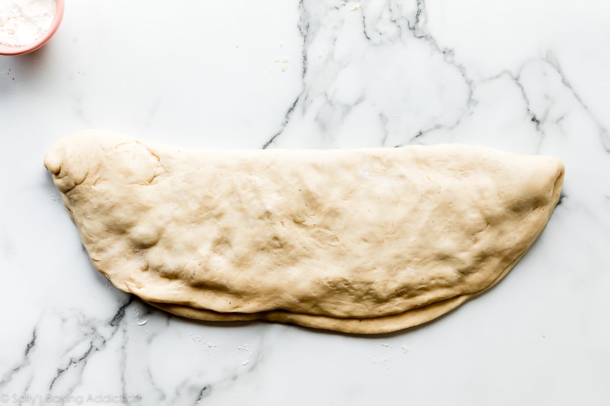 yeasted doughnut dough for berry fritters folded in half