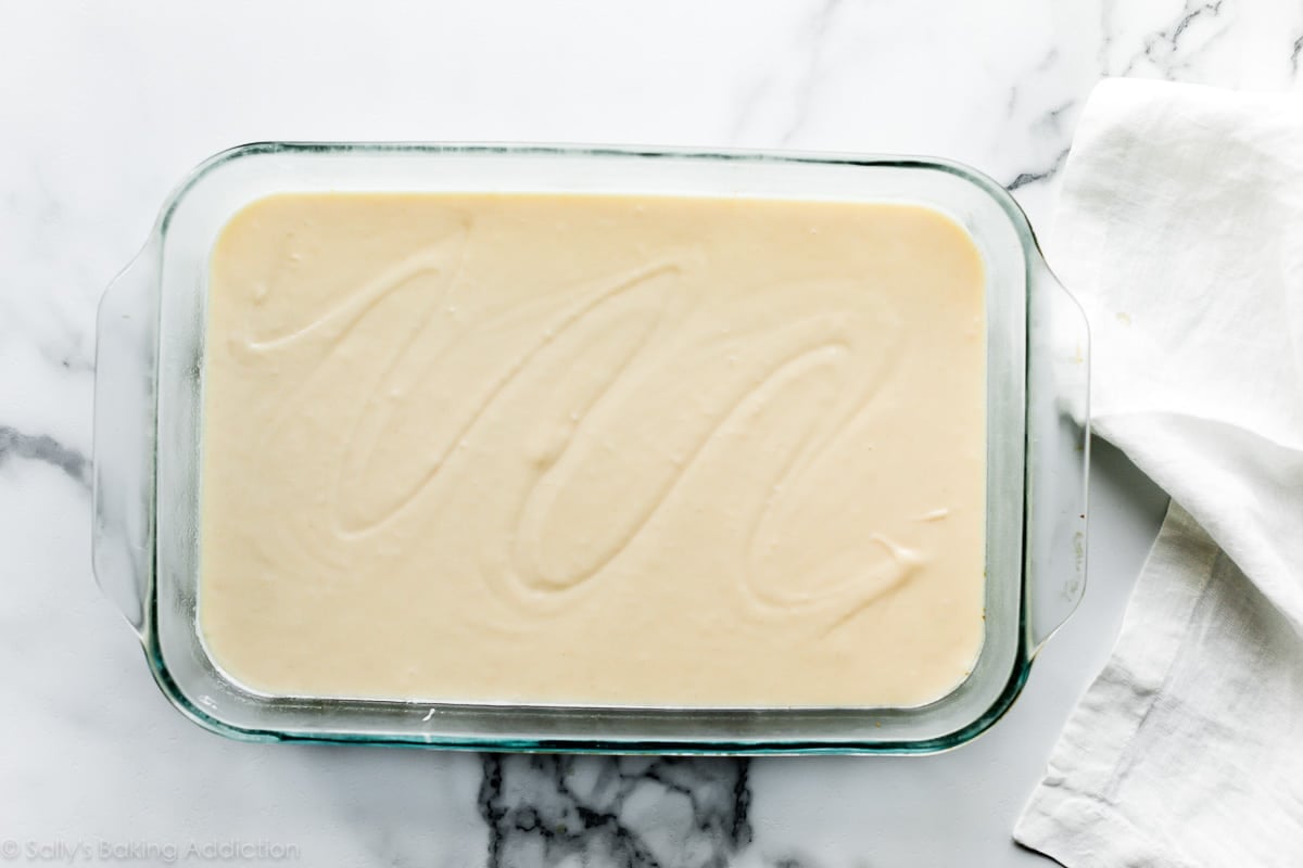 vanilla cake batter in 9x13 inch glass cake pan
