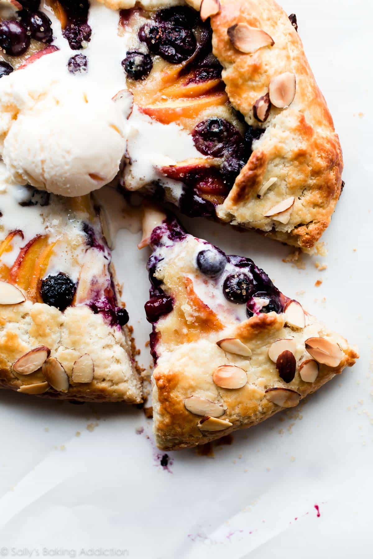 blueberry peach frangipane galette with vanilla ice cream