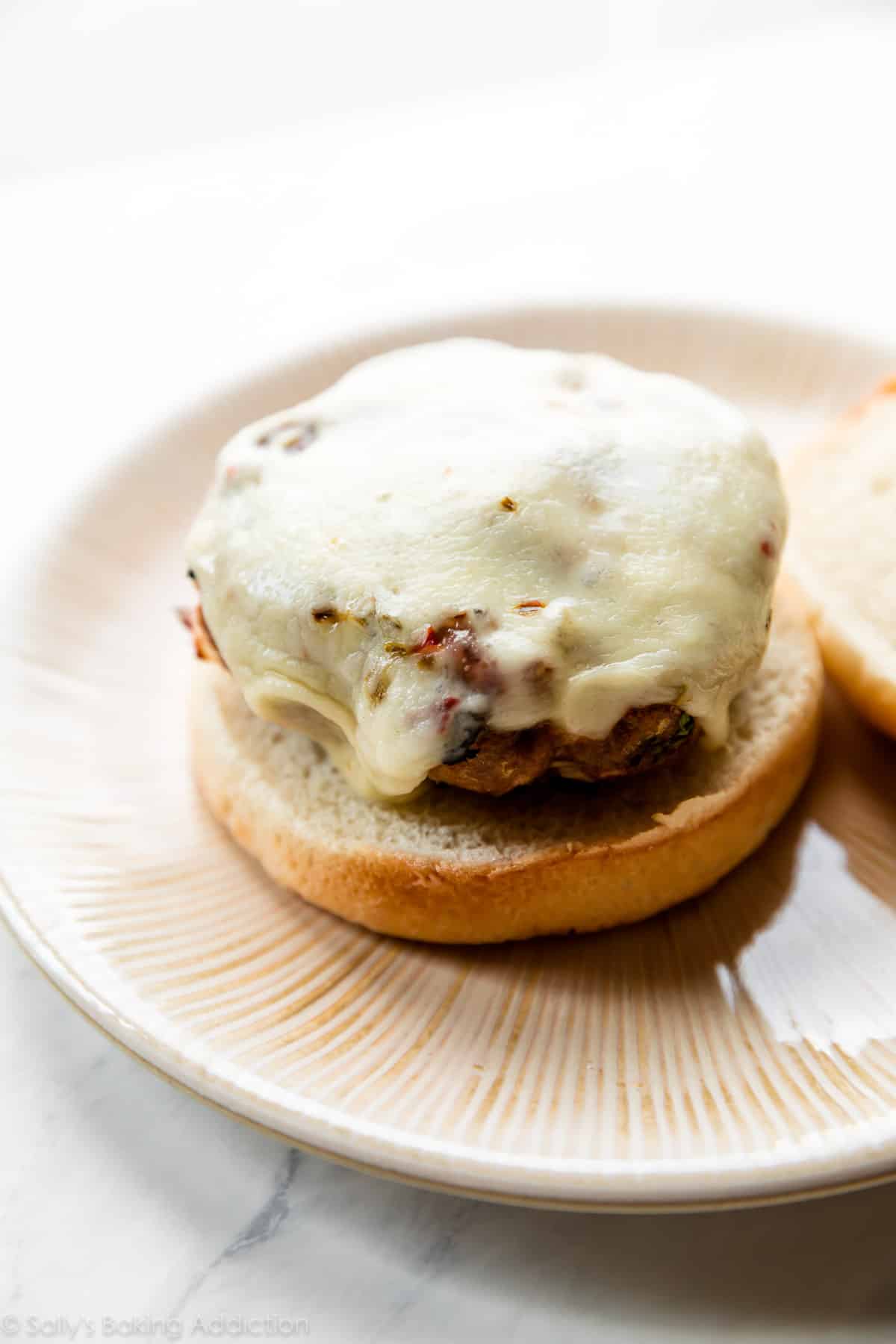 jalapeño turkey burger with melted cheese on a plate