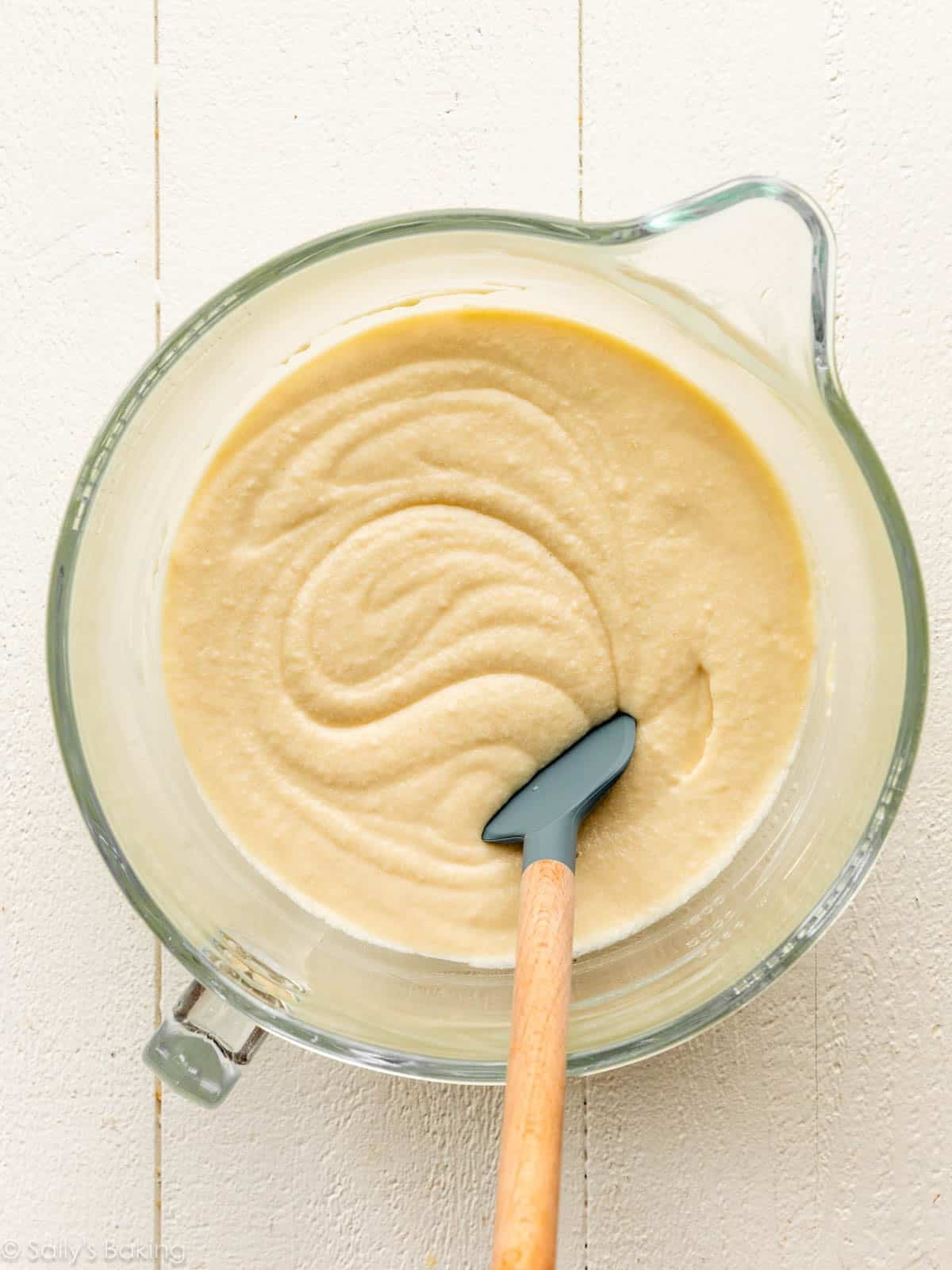 cake batter in glass bowl with spatula.