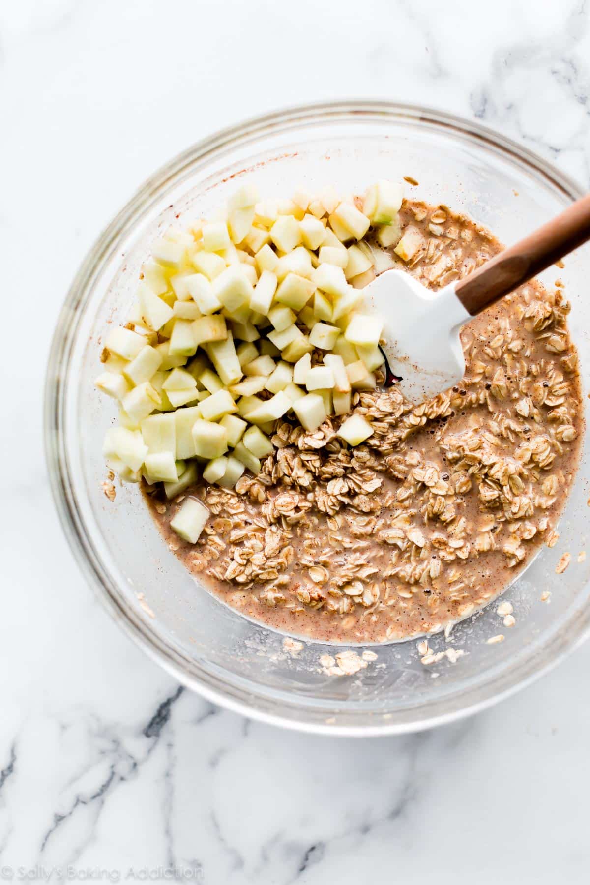 apple cinnamon oatmeal cups batter in a glass bowl