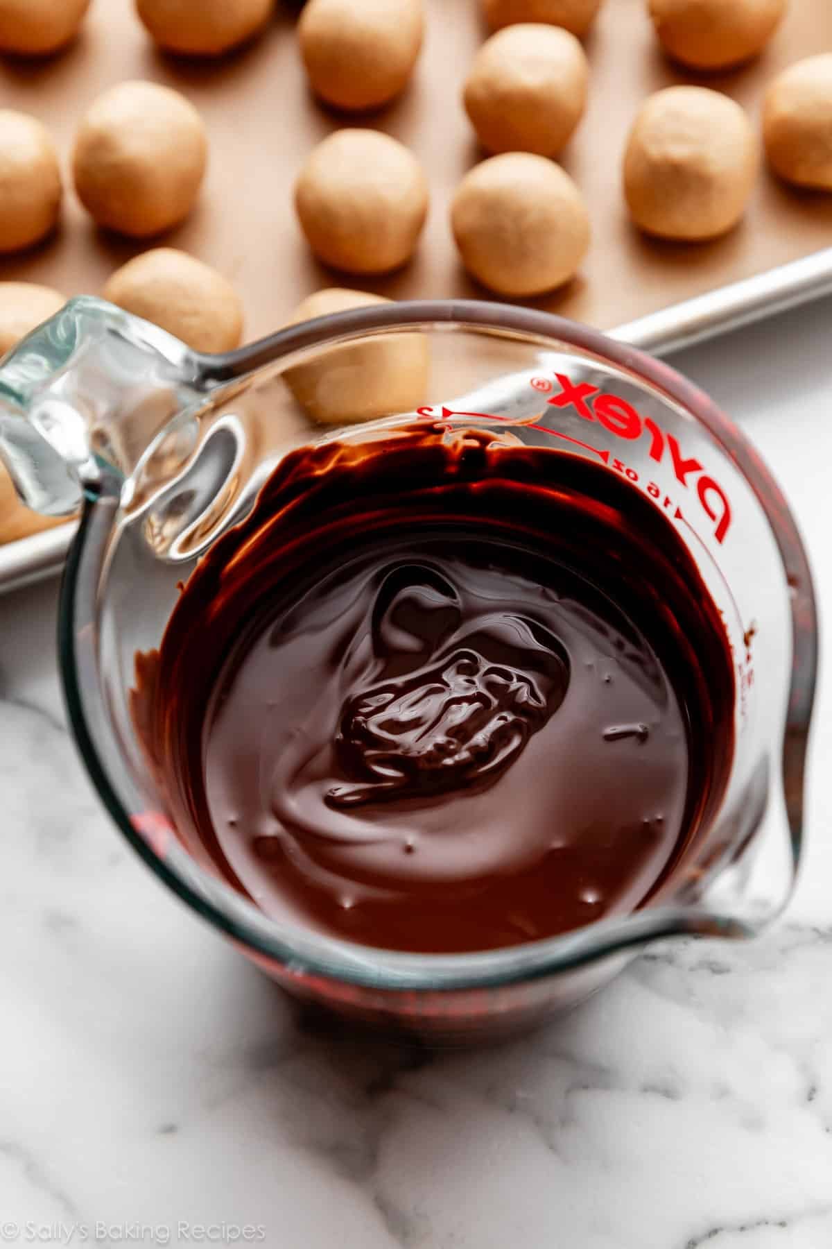 melted chocolate in liquid measuring cup.