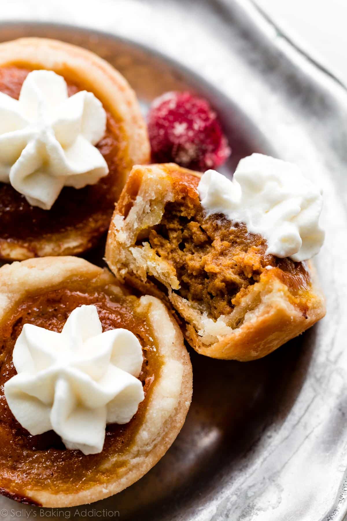 mini pumpkin pie with a bite taken out of it