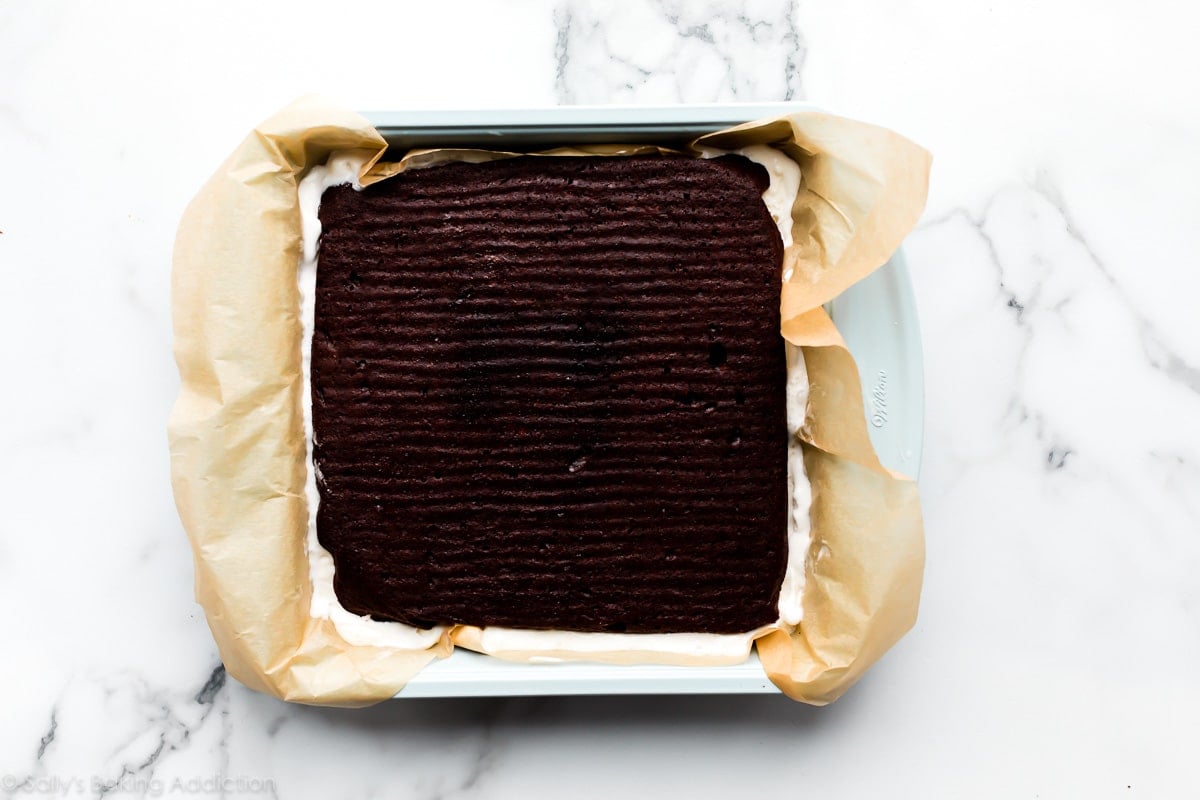 the assembly of homemade brownie ice cream sandwiches