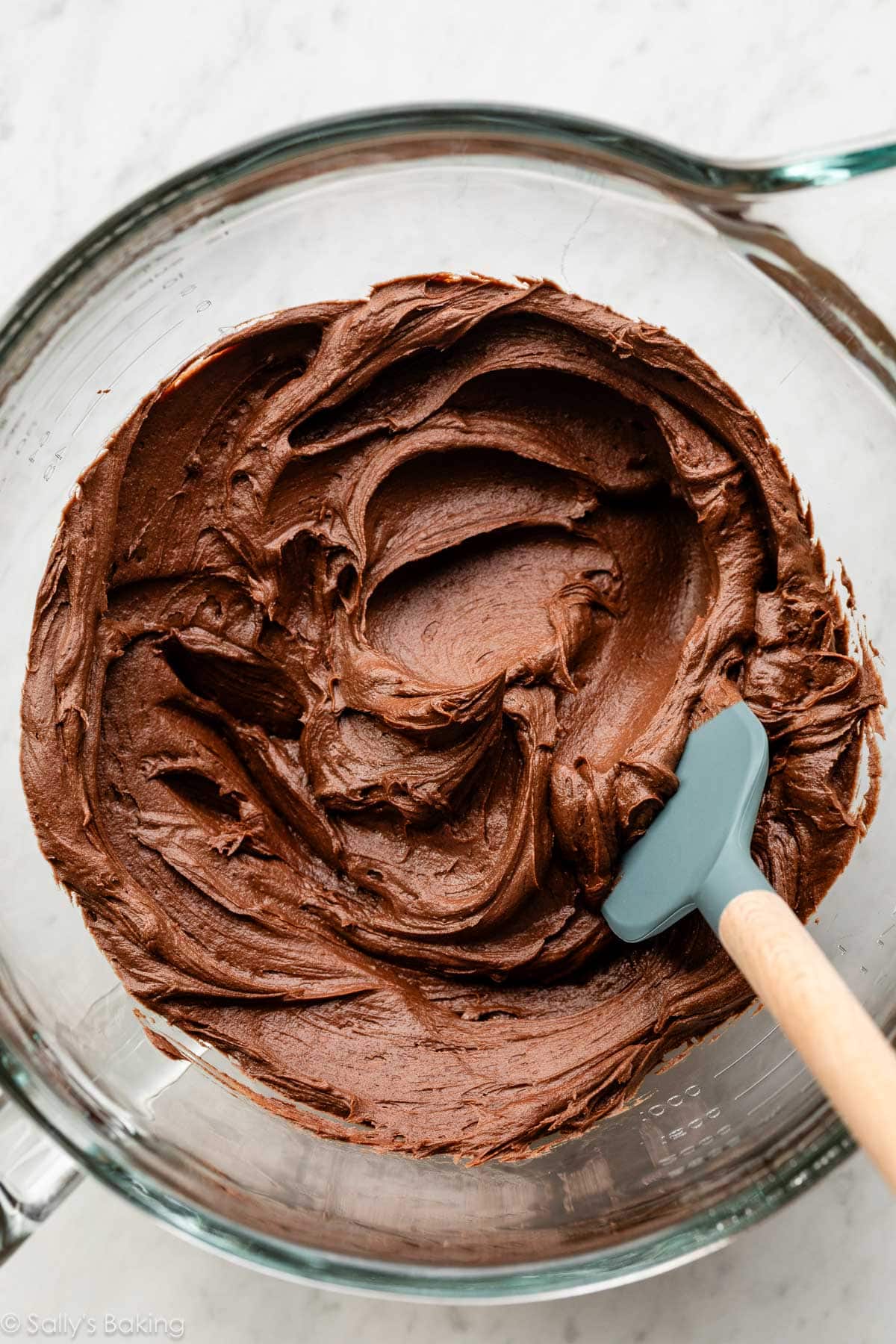 chocolate frosting in glass bowl.