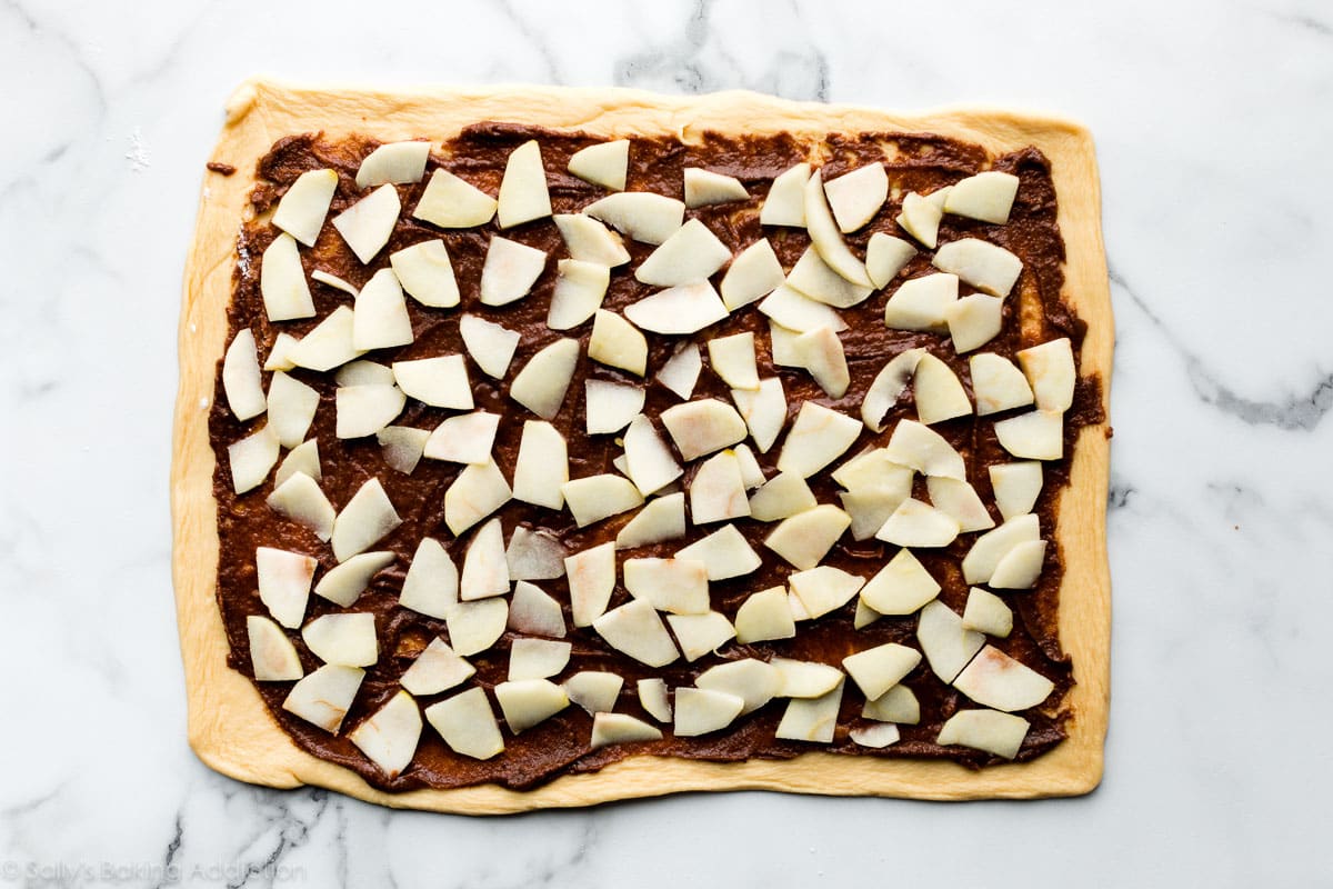 dough with apples and cinnamon filling on top