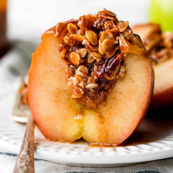baked apple half with brown sugar oat filling inside.
