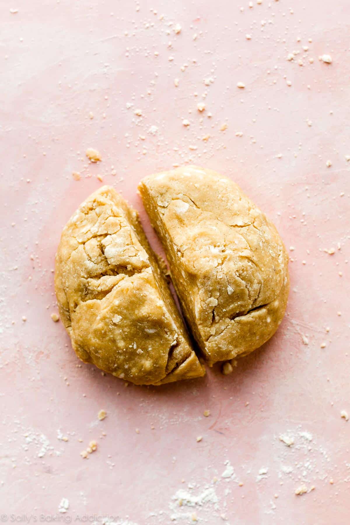 a ball of crumbly dough cut in half