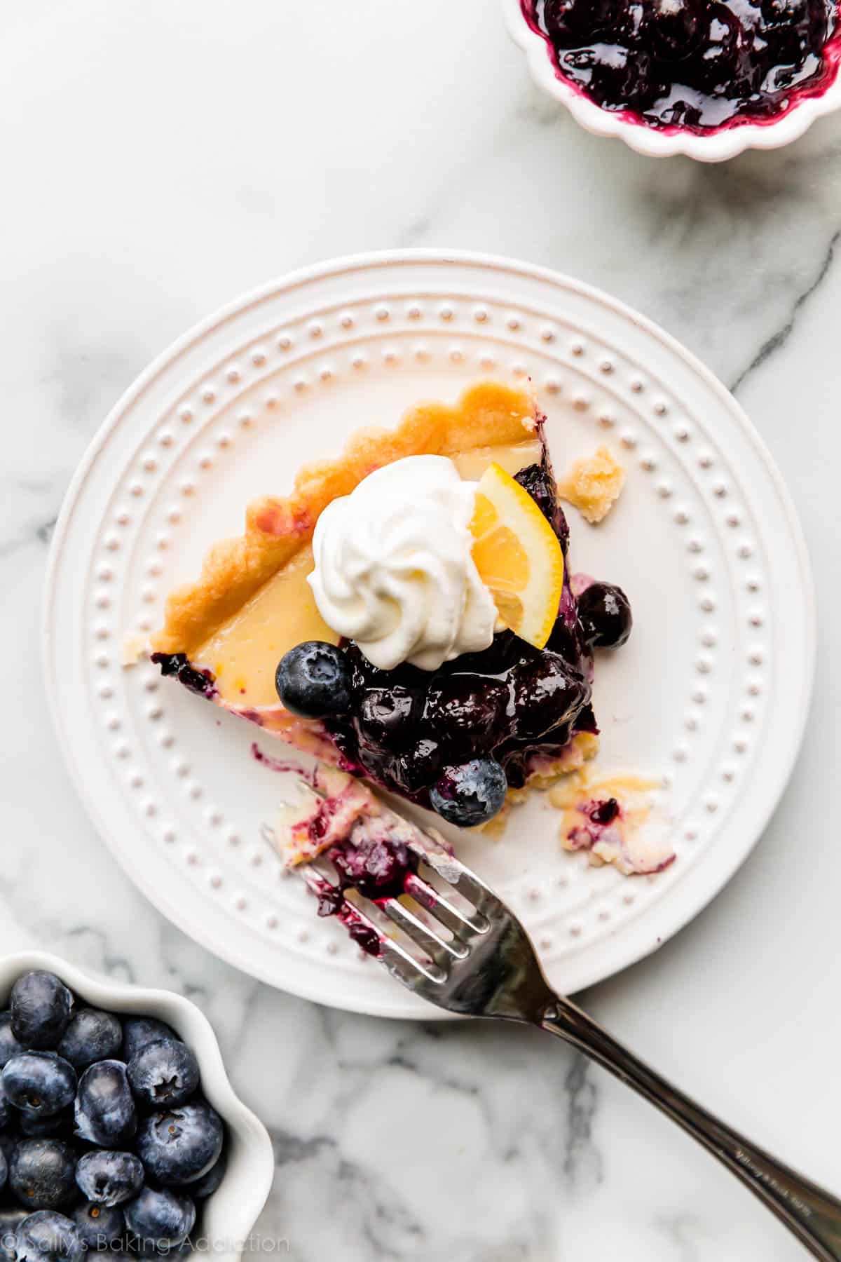 slice of lemon blueberry tart on a white plate