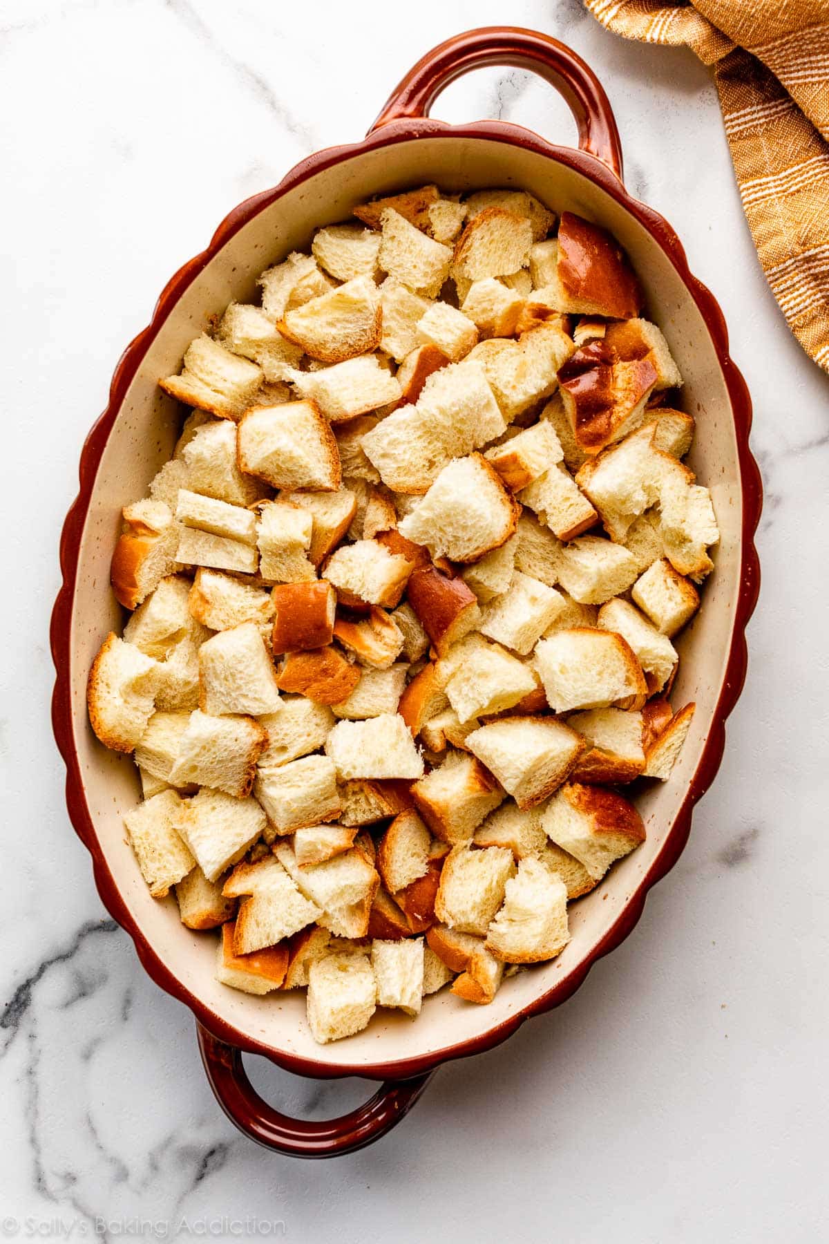 cubed challah bread in casserole dish