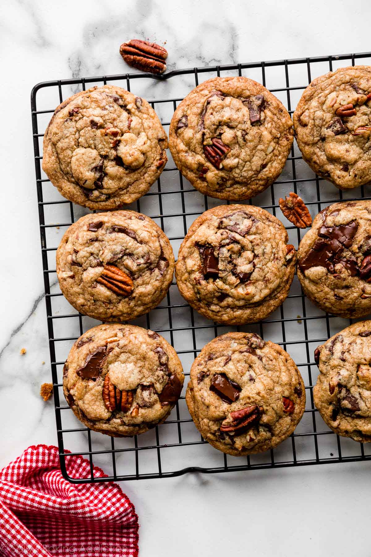 brown butter dark chocolate pecan cookies on cooling rack
