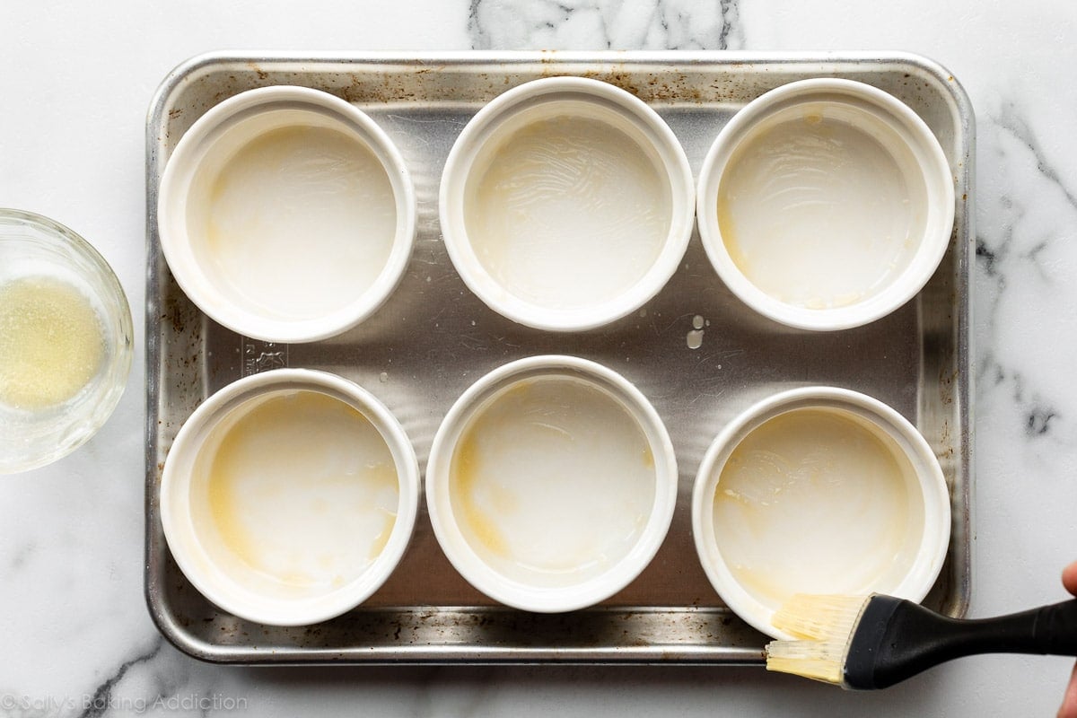 buttered 6 ounce ramekins on small baking sheet