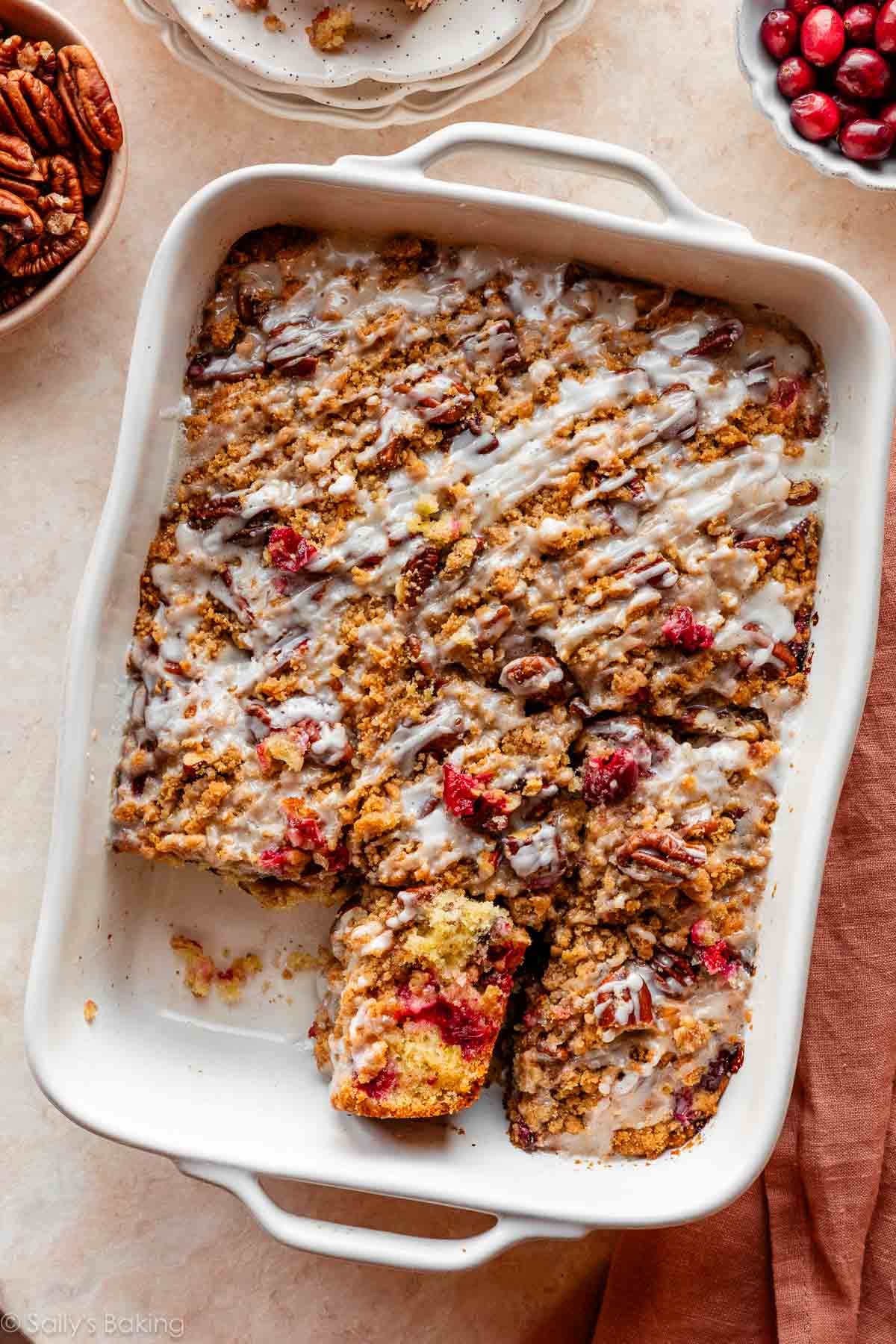 cranberry pecan crumb breakfast cake in white casserole dish.