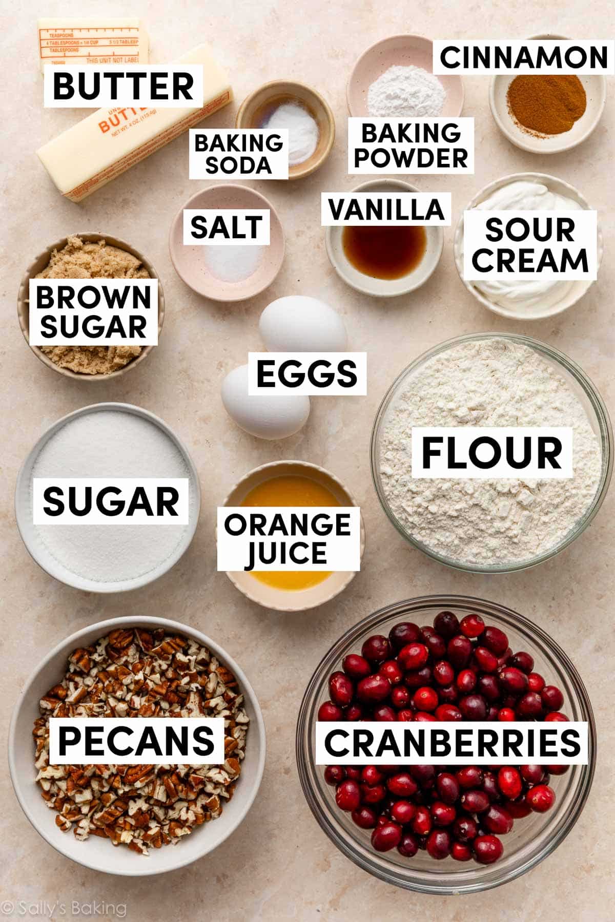 ingredients in bowls including sugar, orange juice, vanilla, sour cream, brown sugar, salt, and flour.
