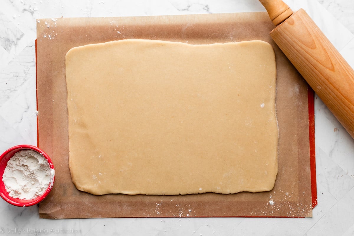 rolled out vanilla dough on parchment paper.
