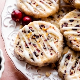 place of cranberry orange cookies with icing drizzled on top of each.